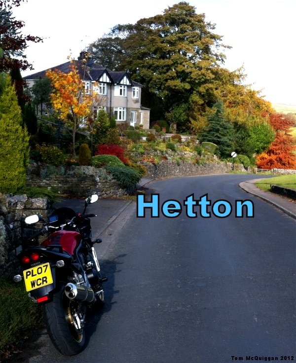 hetton in north yorkshire, a street with pretty house and trees in autumnal colours